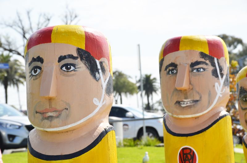 tapered-bollards-painted-as-swimmers-min