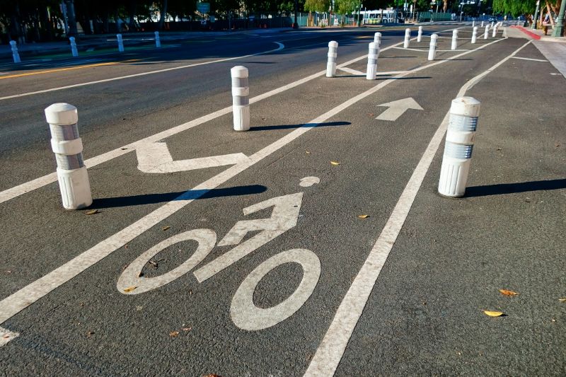 Bollards-a-well-protected-bike-lane-cutting-through-the-city-132108846-min