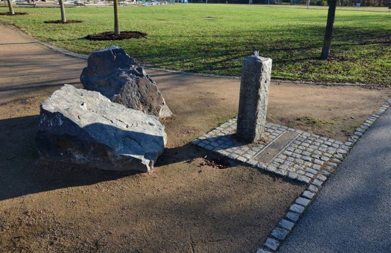 Bollards-at-the-entrance-to-the-bike-path-or-the-park-a-large-stone-is-placed-in-the-middle-of-the-road-as-a-barrier-against-the-car-next-235551713-min
