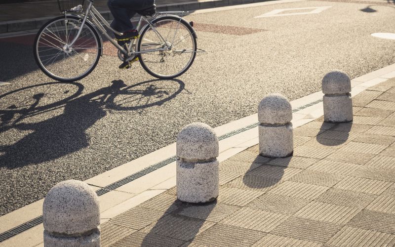 bollards-on-walkway-city-people-cycling-min